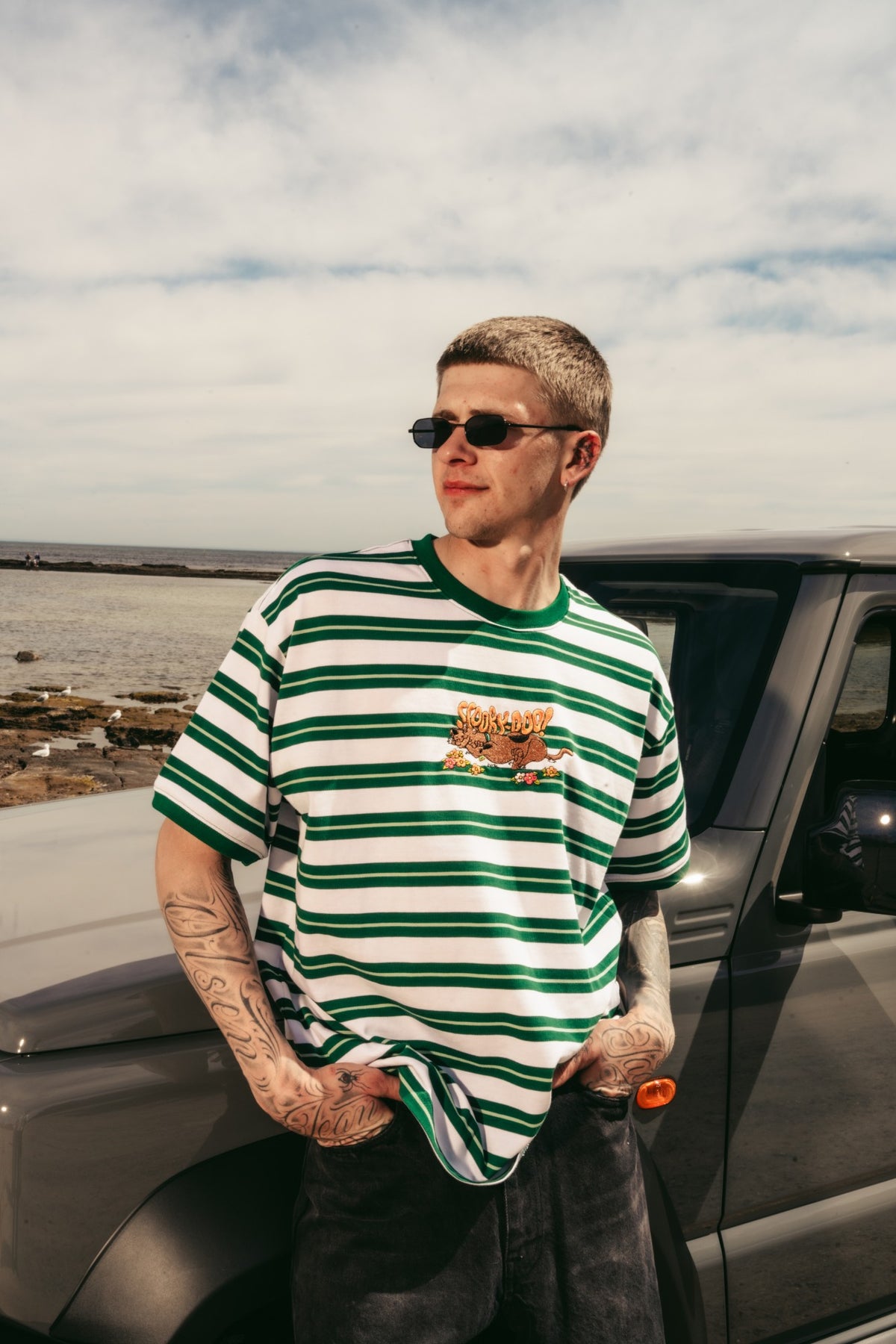 Model in the Scooby-Doo stripe oversized tee by the beach